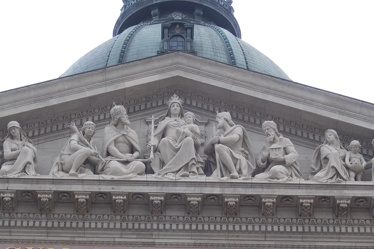 Carved figures on the pediment of St Stephen's Basilica: a seated Madonna and child at the centre with Stephen I, Ladislaus I, Saint Emeric and Saint Leopold to either side